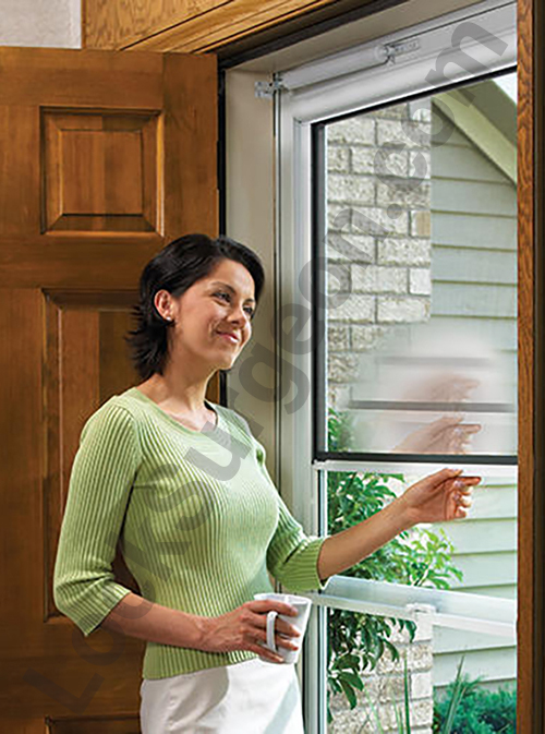 Cochrane Larson screen door showing in use in residential home.